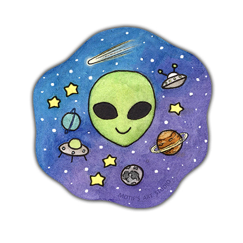 Sticker with a little green alien face, spaceships, and stars on a blue and purple gradient background.
