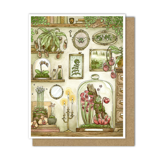 Greeting card with an image of carnivorous plants, orchids and ferns in terrariums surrounded by antique frames and old books.