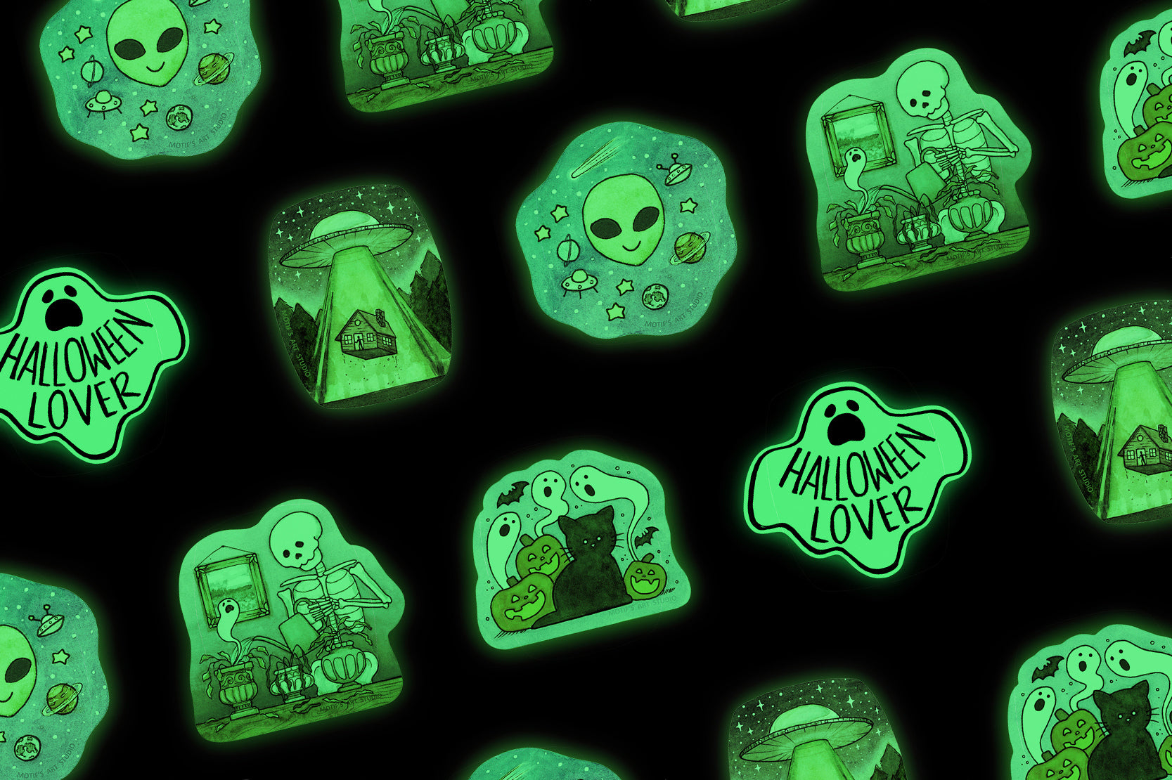 Halloween glow in the dark stickers of black cats, aliens, UFOs, and ghosts.