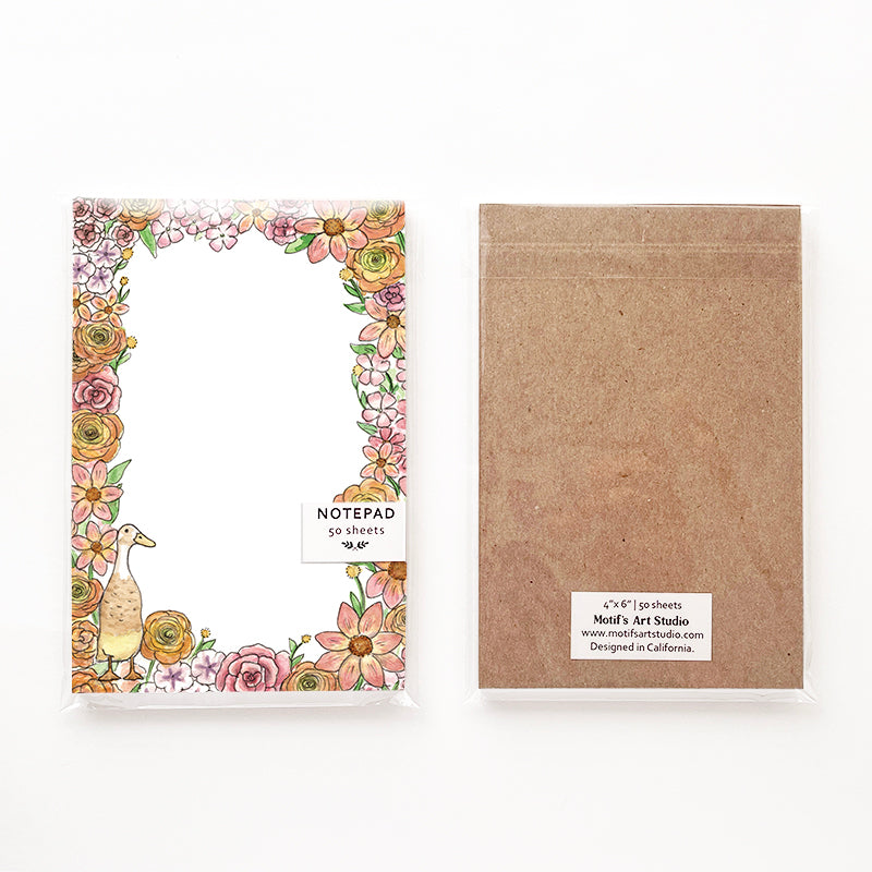 Front and back of a notepad in its packaging.