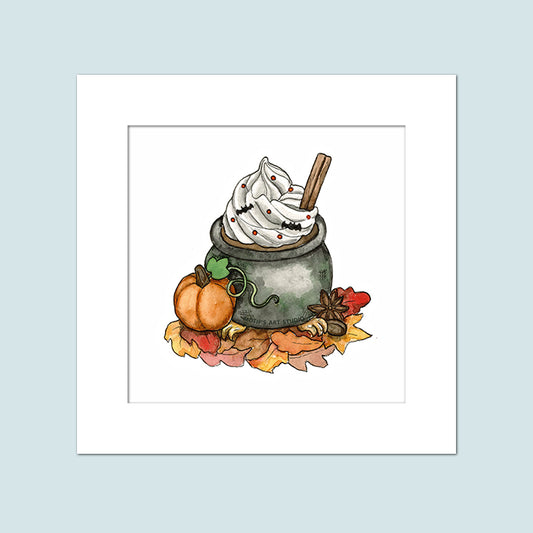 A cauldron mug with gold claw feet sitting on fall leaves with a little pumpkin sitting next to it. The mug has coffee in it with whipped cream with bat sprinkles. Painting is in a white background with a custom white matte.
