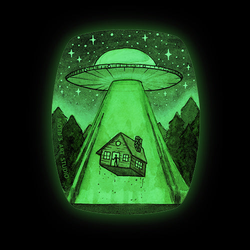 Glow in the dark sticker of a UFO abducting a cabin in the forest