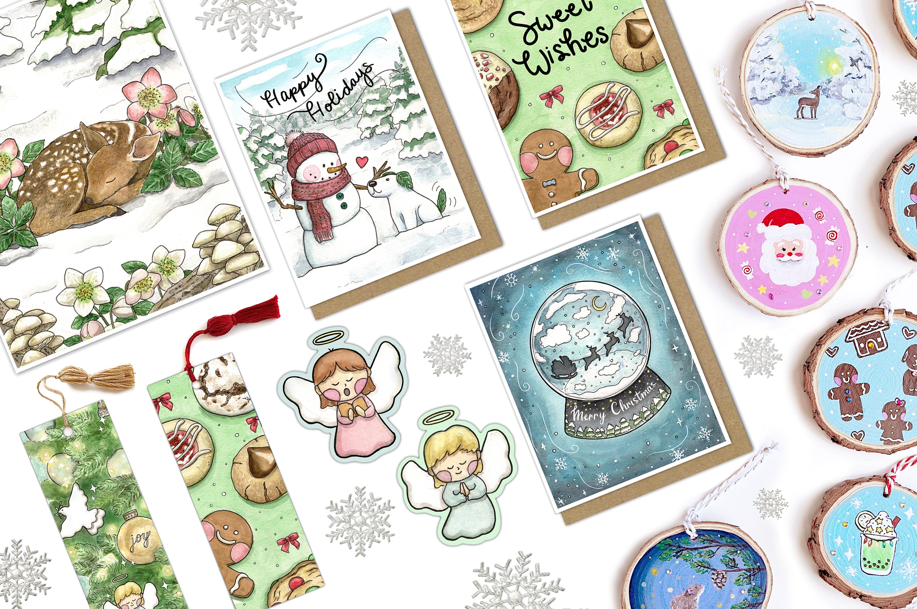 Christmas and holiday collection of greeting cards, stickers, bookmarks, and handmade ornaments featuring snowmen, snow globes, cookies, and angels.