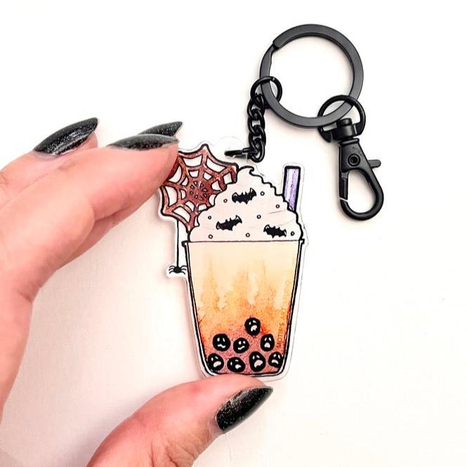 Keychain of a Halloween themed boba drink with a matte black chain.