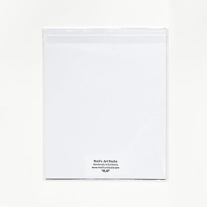 Back of art print with a mat board in cello packaging.