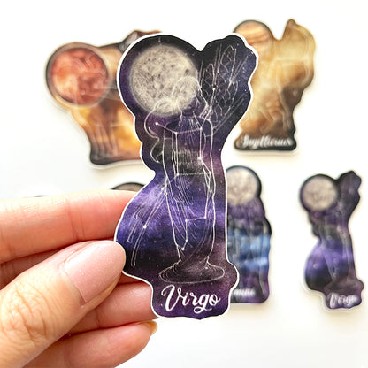 Sticker of a representation of Virgo with the ruling planet, with other astrology stickers in the background.