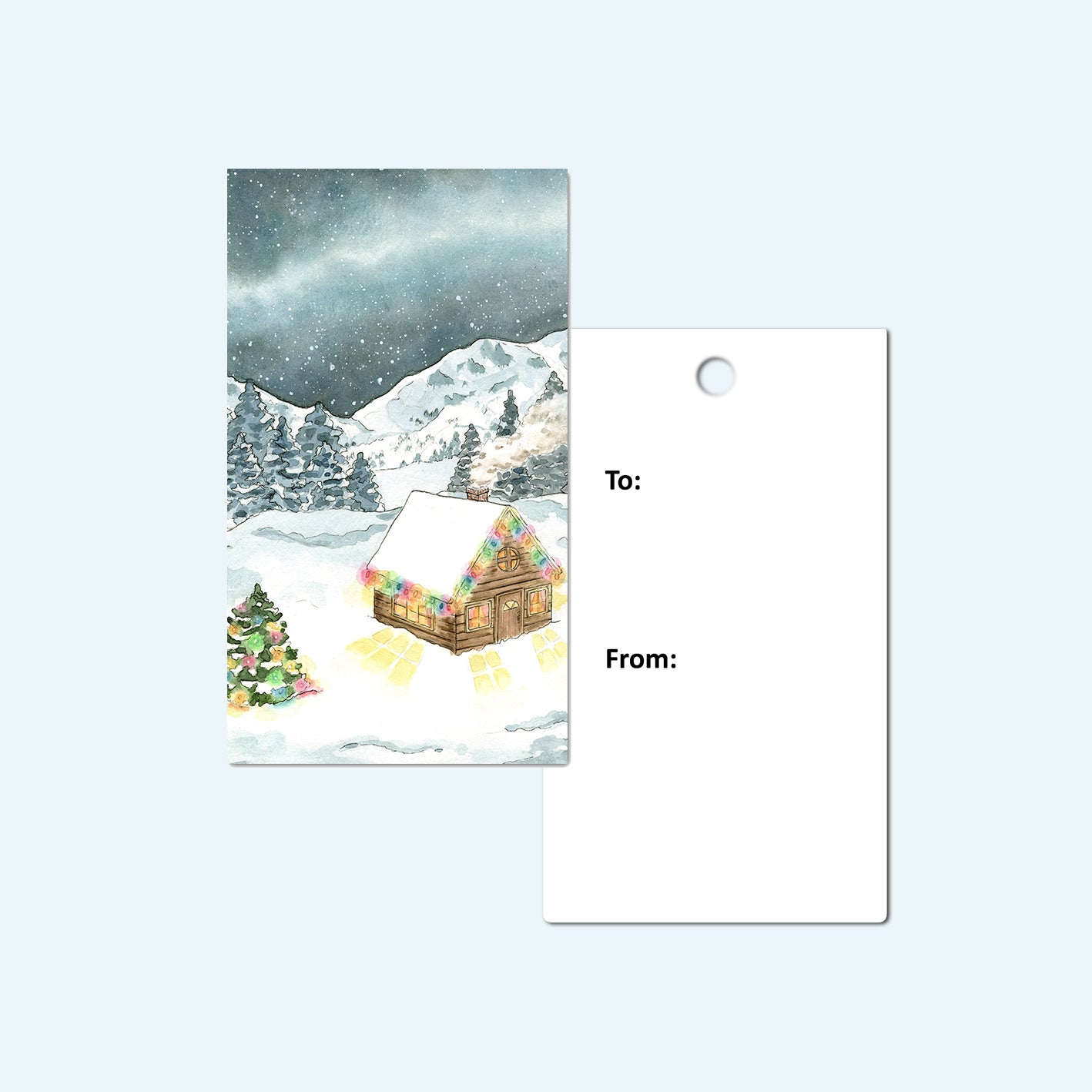 Front and back of Christmas gift tag with snowy cabin.