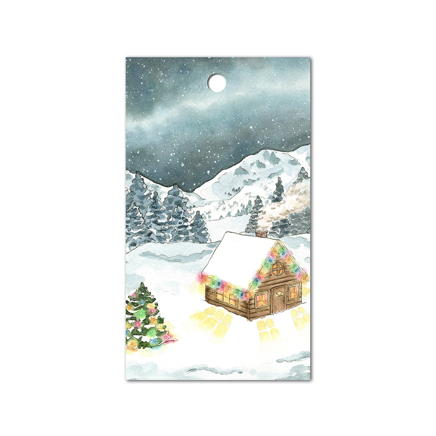 Gift tag of a snowy cabin in the woods with Christmas lights under a starry night sky.