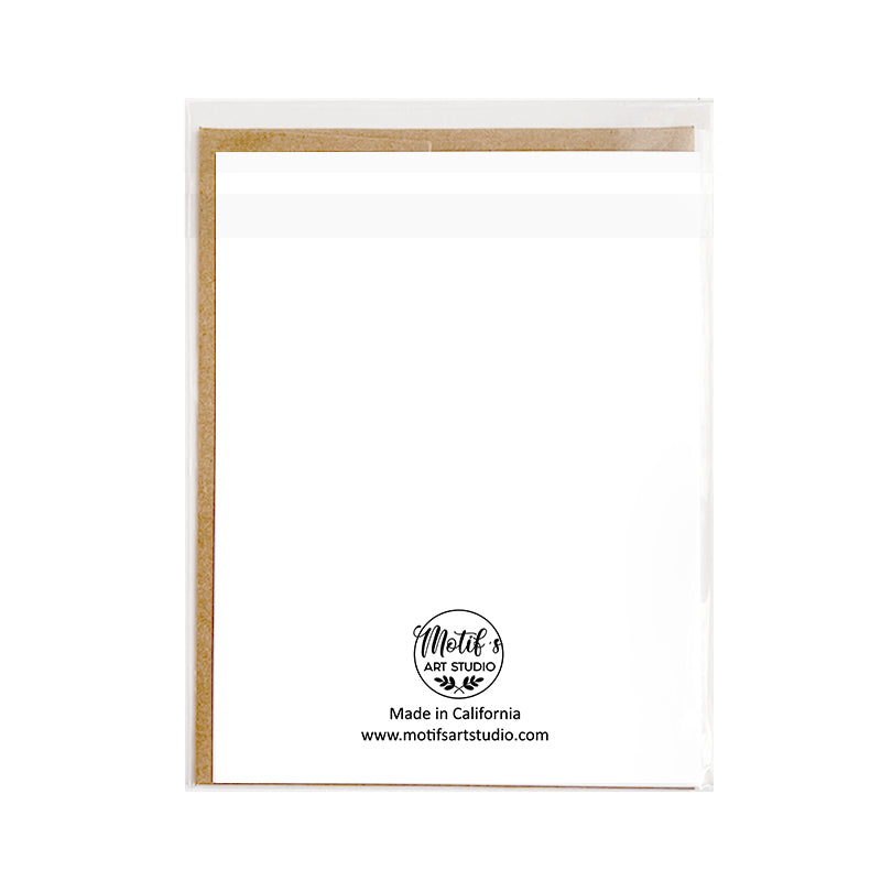Back of greeting card with Motif's Art Studio logo shown in cellophane packaging with kraft envelope inside.