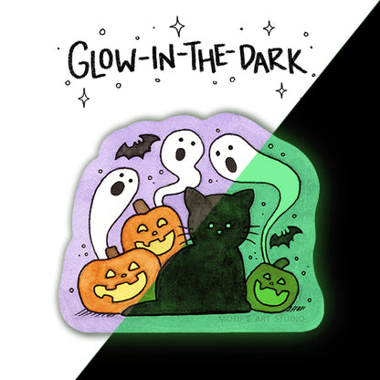 A die cut sticker of a black cat with smiling jack o lanterns and swirling ghosts and bats. Half of the image is glowing.