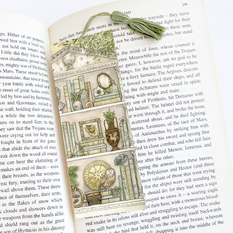 Bookmark that fits inside a book with a light green tassel.