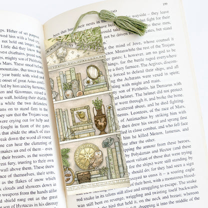 Bookmark that fits inside a book with a light green tassel.