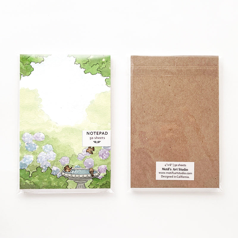 Notepad packaging with a chipboard backing in a cellophane bag.