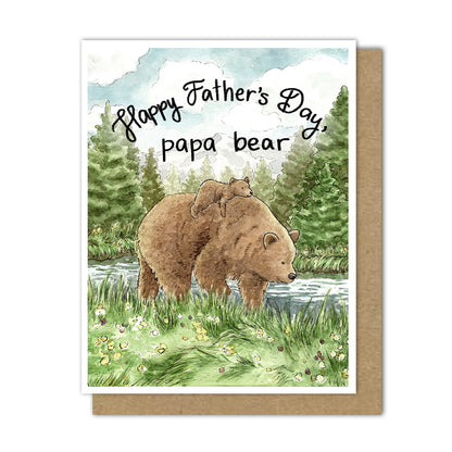 A greeting card featuring a large brown bear with a little cub on its back walking through a meadow next to a forest. It reads "Happy Father's Day, papa bear"