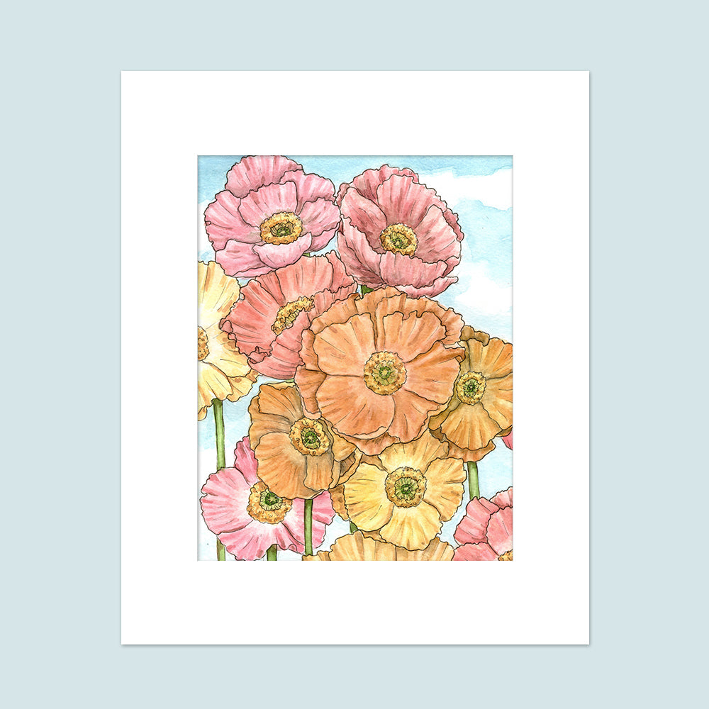 Floral poppy ombre of pinks, yellows, and oranges, with a pale blue sky in the background.