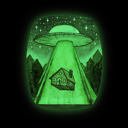Glow in the dark sticker of a UFO abducting a cabin in the forest