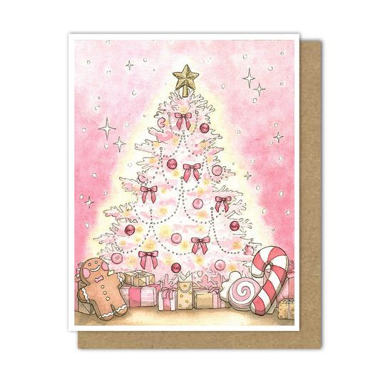 A greeting card with a pink Christmas tree decorated with pink bows, and pink ornaments, topped with a sparkly gold star. Pink presents are under the tree with peppermint plushies and a gingerbread stuffie.