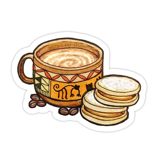 A sticker of a ceramic cup with a Peruvian design with alfajor cookies and coffee beans sitting next to the cup. with coffee with
