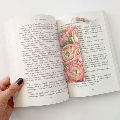 An example of a bookmark with tassel in use with a book.